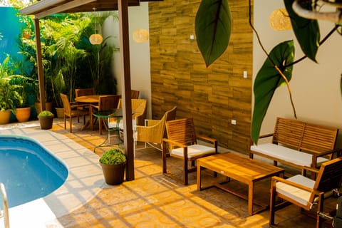 Outdoor pool, open 9:00 AM to 9:00 PM, pool umbrellas