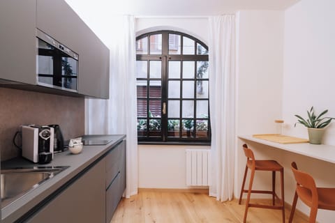 Standard Apartment | Living area | 32-inch flat-screen TV with satellite channels