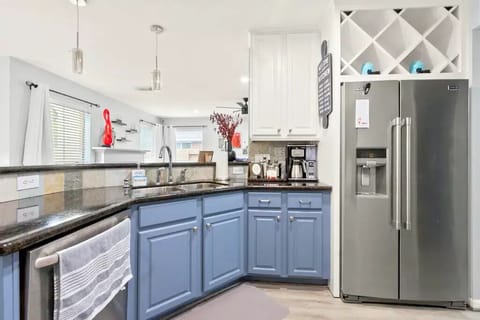 Prepare meals effortlessly in a kitchen with modern appliances and abundant counters.