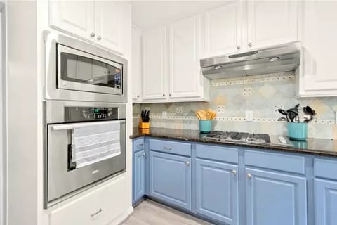 Cook with ease in this well-equipped and inviting kitchen space.