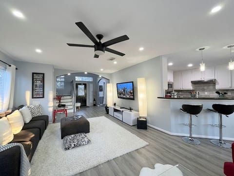 Step through a bright, open layout linking the cozy living room and sleek kitchen.