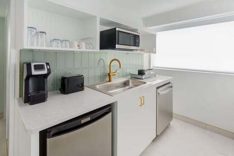 Room, 1 King Bed (Gulf Front Balcony) | Private kitchen | Fridge, microwave, coffee/tea maker, eco-friendly cleaning products