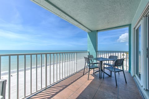 Savor your morning coffee with panoramic ocean views from this private beachfront balcony, where gentle waves and endless sky create your daily backdrop.