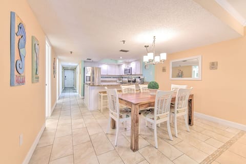 Gather around your beautiful dining table in this bright, open space that flows seamlessly into the modern kitchen.