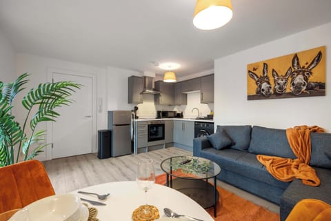 Interior designed and modern, the living room comes a equipped with a comfy pullout double sofa bed and smart TV