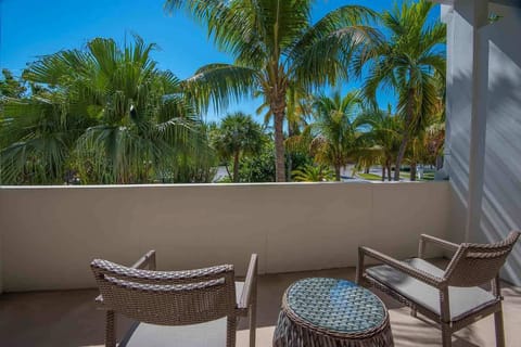 Sip, unwind, and soak up the lush surroundings from a private perch tucked beneath swaying palms.