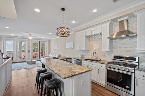Chef’s kitchen with gas range + granite counters