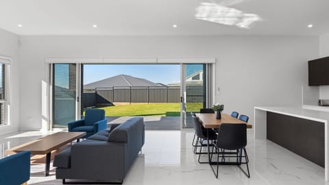 Spacious Living Area Featuring Kitchen and Dining Set
