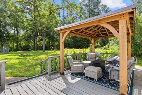 Relax, unwind, and enjoy fireside vibes in this charming outdoor space.