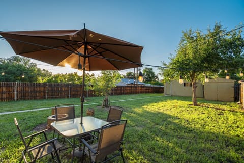 Enjoy a large, fully fenced grassy yard, perfect for pups! Dine under the umbrella, unwind by the propane fire pit, and enjoy the peaceful Colorado Springs evenings.