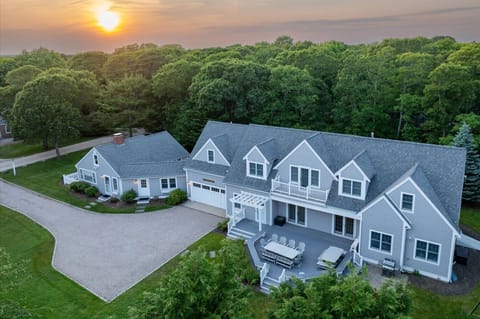 Unwind on the front patio as the sun dips behind the trees.