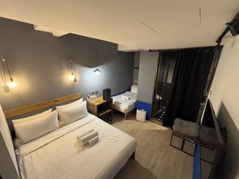 Basic Triple Room, Non Smoking | Desk, laptop workspace, free WiFi