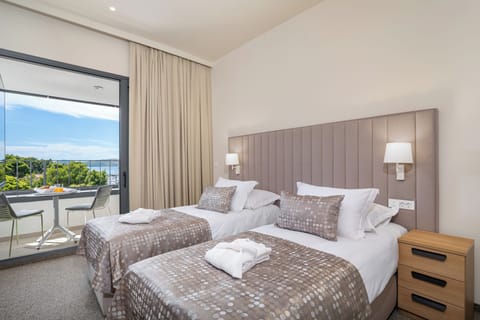 Deluxe Double or Twin Room, Balcony, Sea View | Minibar, in-room safe, desk, blackout drapes