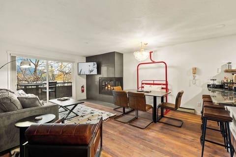 Kick your boots off, drop onto the vintage chairlift bench, and let the wood-burning fire take the chill out of the day this open living, dining, and kitchen space is where your whole trip comes together.