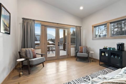 Top floor Master Bedroom with King bed, coffee bar and seating. French doors out to the deck for seating to sip your coffee and take in the VIEWS!!!