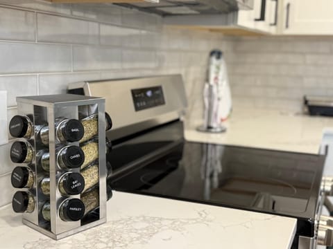 Fully equipped kitchen with oven & fridge can cook and store meals 