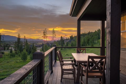 - Dine outdoors while soaking in dramatic sunset views over the mountain hills - Spacious deck with wood dining set is perfect for al fresco meals and wine - Tranquil forest surroundings create a peaceful and unforgettable backdrop