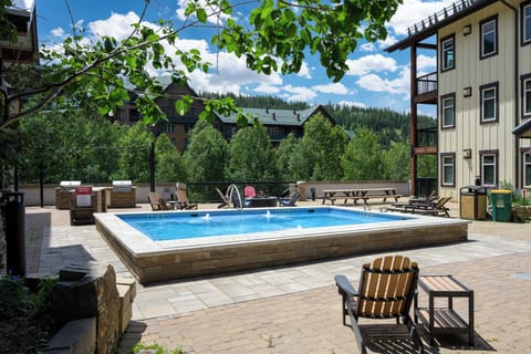 Walk one flight down to hot tub and shared outdoor patio.