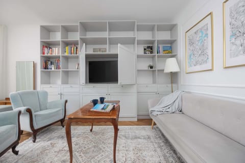 A third living room angle showing additional seating and soft lighting. Elegant and welcoming.