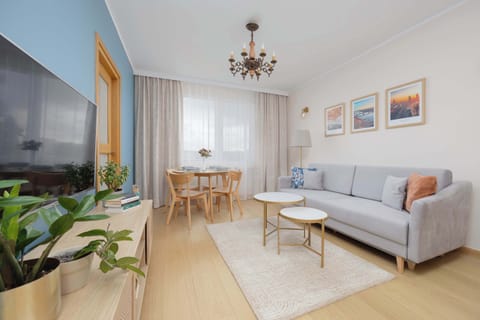 Another view of the living room showing its spacious and well-lit interior.