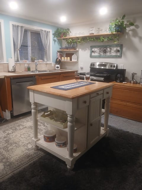 The kitchen island is helpfull for extra counter space and storage. 