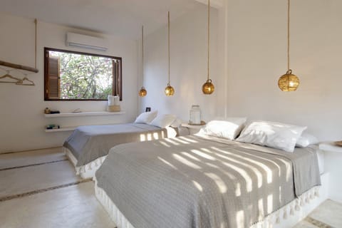 Comfort Quadruple Room, 2 Queen Beds, Garden View | Blackout drapes, iron/ironing board, free WiFi