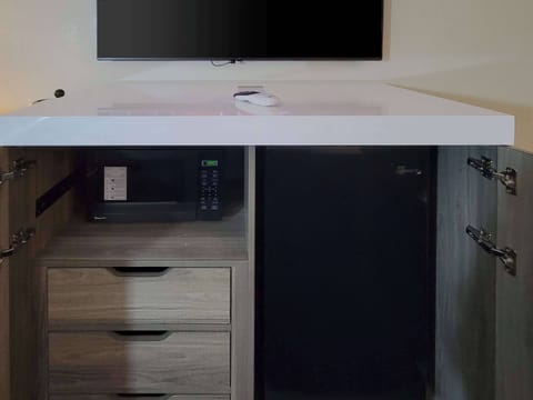 Premium bedding, desk, laptop workspace, blackout drapes