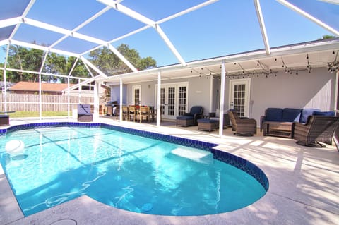 Heated and screened pool.  Outdoor living and dining space.  