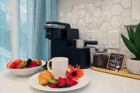 Kitchen Nook: Sip your morning brew with fresh pastries and vibrant fruits at your fingertips!