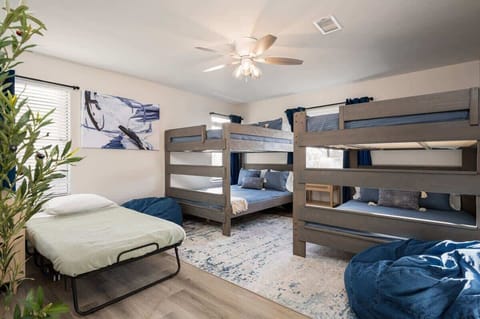 Bunk Room: Fun-filled escape with 2 queen-over-queen bunks and vibrant decor for unforgettable stays add a rollaway for extra guests!!