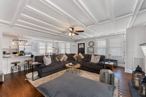Open-concept living space with large sectional—ideal for relaxing together.
