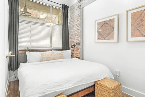King bed in the cozy primary bedroom