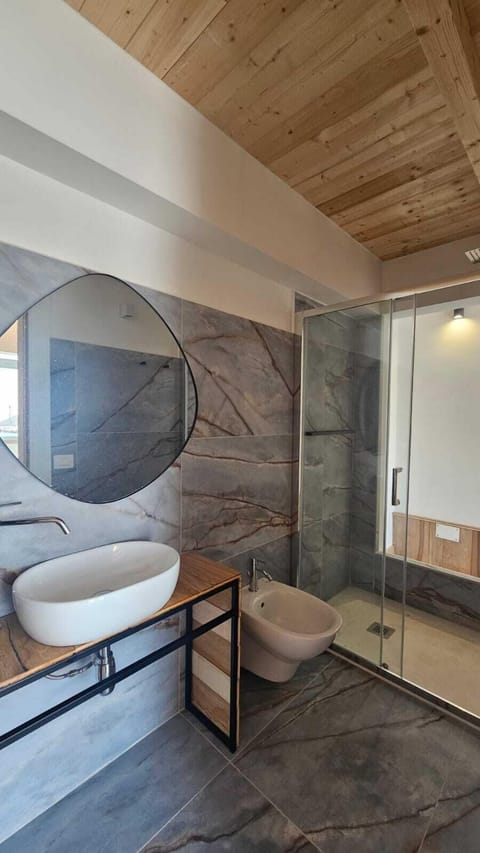 Luxury Suite, Sea View | Bathroom | Hair dryer, bathrobes, slippers, towels