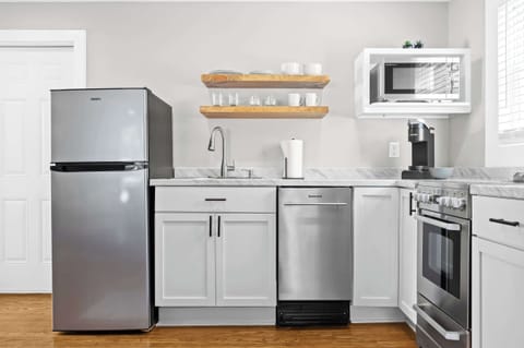 Kitchen: Whip up your favorite meals in this fully equipped kitchen — where modern amenities meet homey charm for a seamless cooking experience.