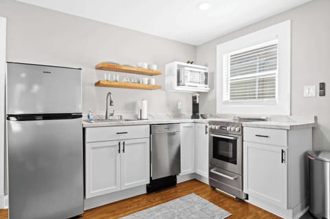Kitchen: Whip up your favorite meals in this fully equipped kitchen — where modern amenities meet homey charm for a seamless cooking experience.