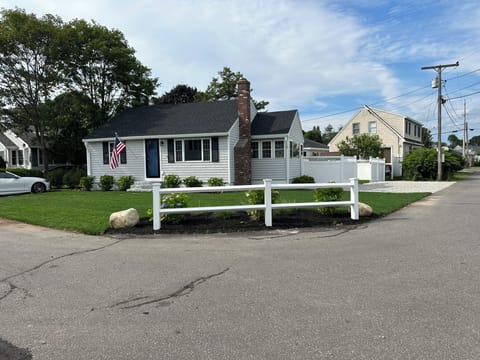 Cottage sits on professionally landscaped 
corner lot.