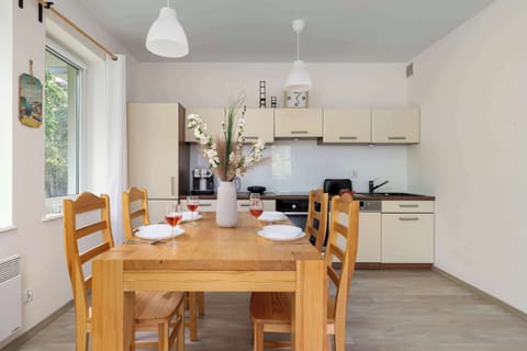 The breakfast table by the window is a perfect spot to enjoy your coffee and plan your day.