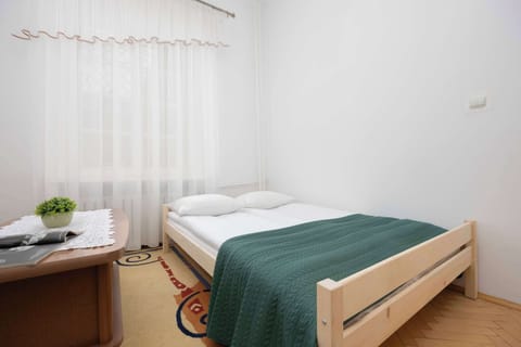 Bedroom with a comfortable double bed providing peaceful sleep and privacy.
