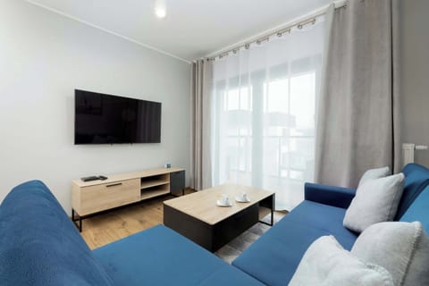 Relax in the stylish living room with a comfortable sofa and modern decor.