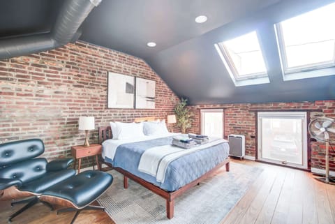 The ultimate vacation retreat at this exquisite home, boasting a prime location and impeccable design. Wake up refreshed in the spacious bedroom, featuring skylights, exposed brick and cozy modern design, the perfect retreat after a day of exploring!