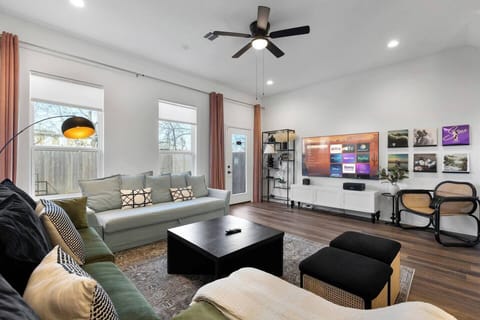 Living Room Retreat: Bright space with stylish decor, perfect for movie nights or relaxing chats!