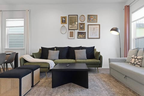 Living Room: Comfortable seating, air conditioning, heating, ceiling fan, board games, record player, sound system, and a large Smart TV for your entertainment.