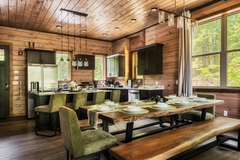 Open floor plan with spacious dining area and well stocked kitchen