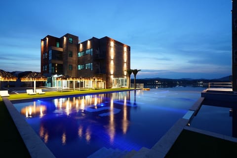 Seasonal outdoor pool, open 8:00 AM to 9:00 PM, pool umbrellas