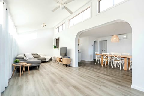 The open-concept living and dining area is designed to maximize space, creating an inviting setting for gathering and entertaining.