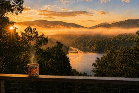 Wake up to sunrise over Lake Blue Ridge with panoramic mountain and water views 