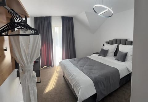 Deluxe Double Room, Balcony, Pool View | Blackout drapes, soundproofing, iron/ironing board, free WiFi