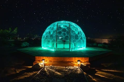 Not a tent. Not a cabin. Not a hotel room. A transparent crystal dome in the middle of the Mojave Desert where the stars are so close you could reach out and touch them