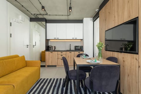 Large table with chairs for eating communal meals.
