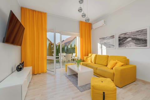 Living room with a comfortable sofa and TV.